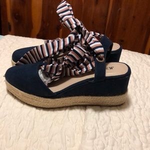 Navy blue with low wedge ties up around ankle or higher